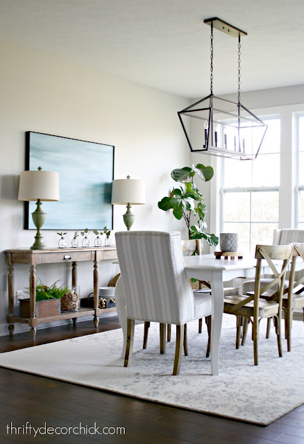 Dining area with white table and wood chairs