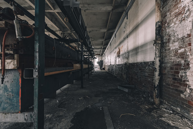 large disused industrial machinery with rust