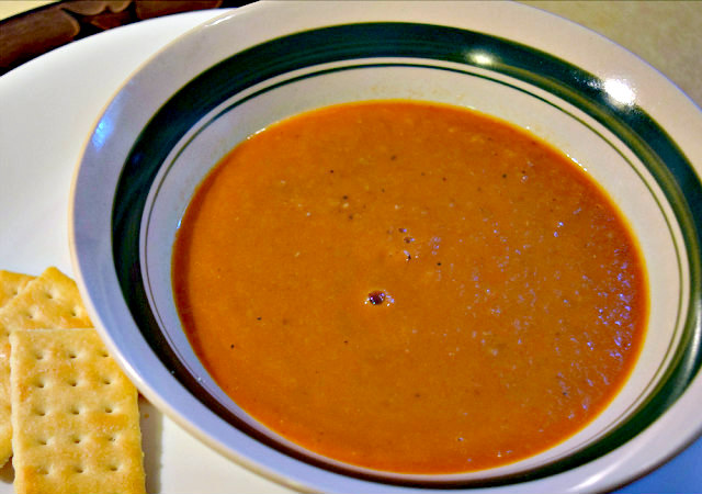 A bowl of delicious homemade tomato soup using fresh tomatoes.