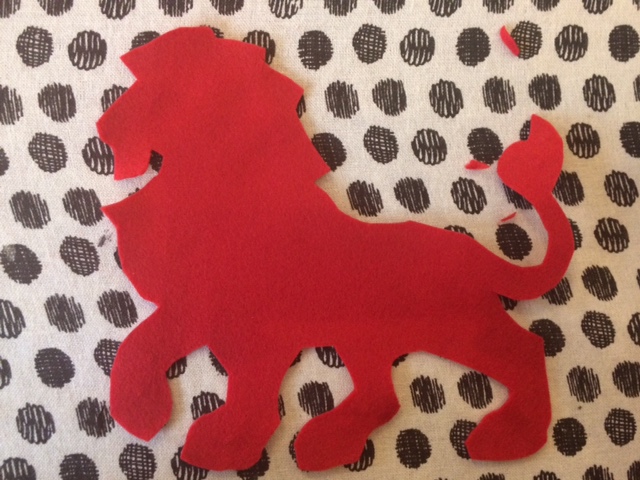 Lion cutout of red fabric