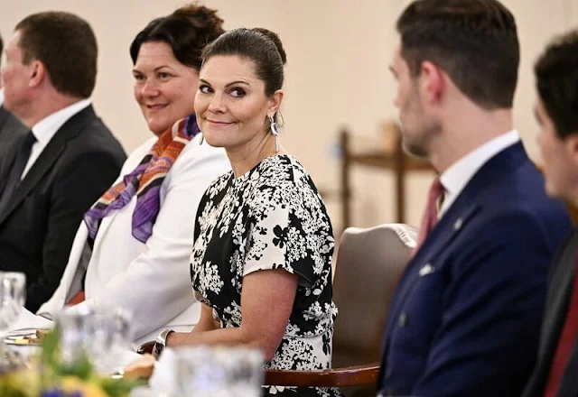 Crown Princess Victoria wore a new Slouch waist floral dress by Toteme. Lara Bohinc saturn earrings