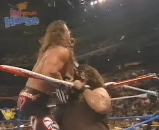 WWF / WWE IN YOUR HOUSE 10: Mind Games - Mankind locks the mandible claw on Shawn Michaels in the WWF title match