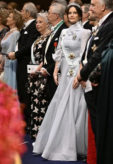 Crown Princess Victoria's gown is created by Camilla Thulin. Princess Sofia is wearing LWL Jewellery earrings