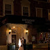 Bride and Groom in Front of the Hotel at Night