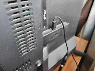 Fire TV Stick in the back port of a TV