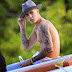 Shirtless Justin Bieber, 20, appears to sip beer as he parties with scantily clad women  on a yacht in Miami