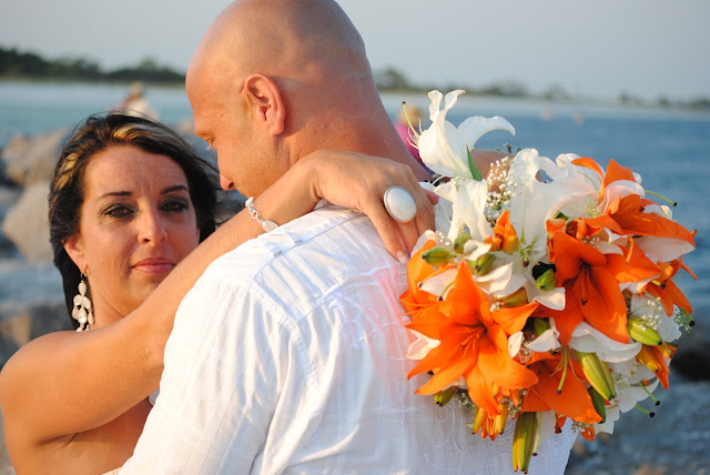 Bride looks over grooms shoulder by Amanda Puskar Photography