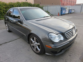 Peeling paint & old color on Mercedes before being repainted at Almost Everything Auto Body