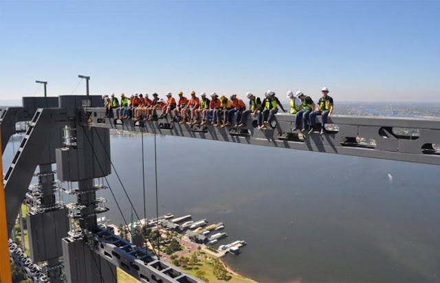 Construction workers wearing construction clothes on the skyscraper