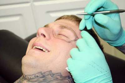 A Guy Gets His Face Tattoed
