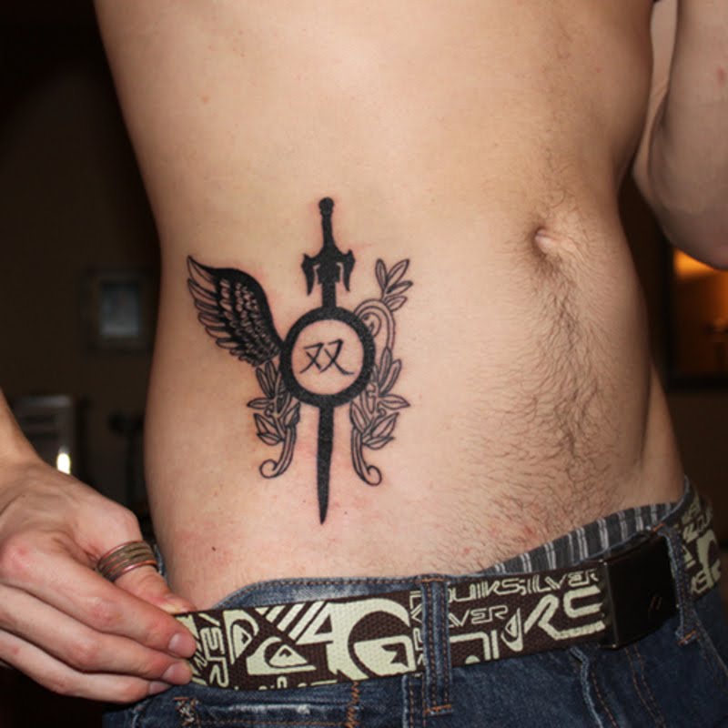 Sword tattoo on abdomen