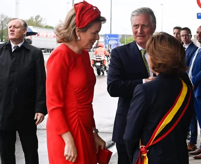 Queen Mathilde wore a red dress by Natan, Grand Duchess Maria Teresa wore a green belted jacket by Alexander McQueen