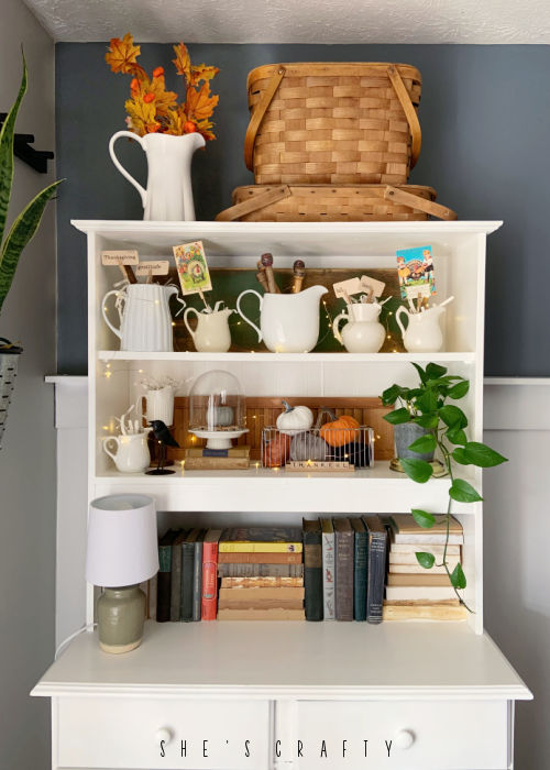 Thanksgiving decorations on step back cupboard