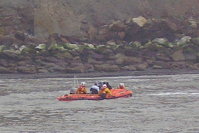 Whitby Inshore Lifeboat Making a rescue at Saltwick Bay