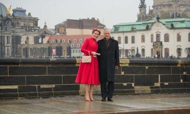 Queen Mathilde wore a red dress outfit, and fur collar coat in camel. Federal President Frank-Walter Steinmeier and Elke Büdenbender