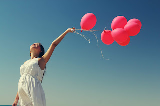 a girl with a balloons