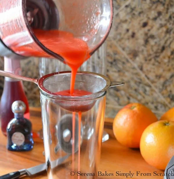 Strain Strawberry Grapefruit Mimosa to remove pulp for Strawberry Grapefruit Mimosas.