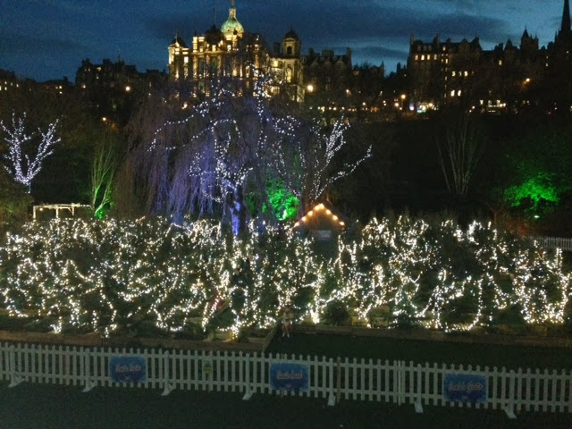 A photo of the fairy light maze in Edinburgh's Santa's Grotto looking up to the Old Town architecture.