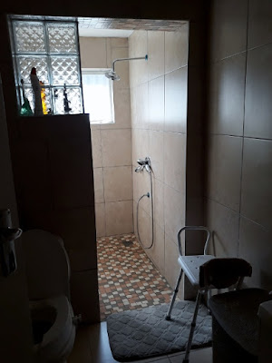 tiled bathroom and toilet