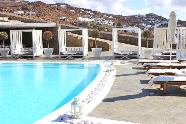 Rocabella Hotel pool and white lounge space