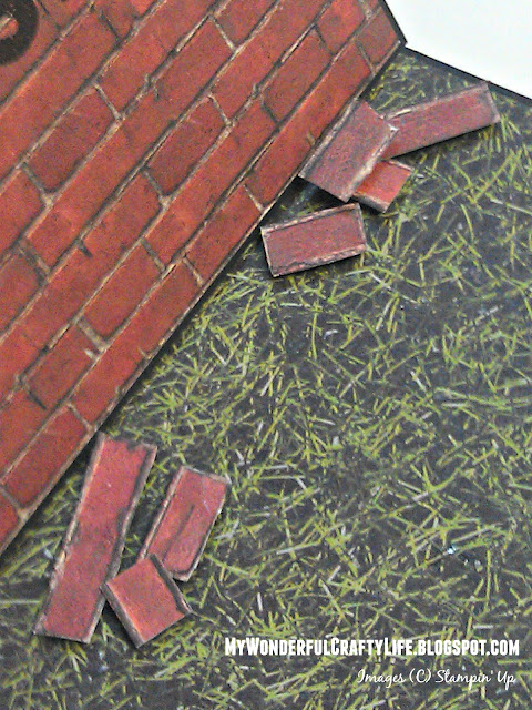 Hand cut bricks glued on grass paper to resemble fallen bricks