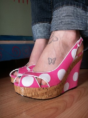 Butterfly   Girl   Tattooed feet in flip-flop