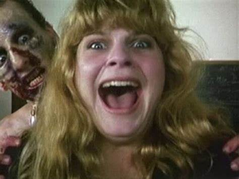 Actress Jolie Jackunas as Kuller screaming as a zombie attacks her