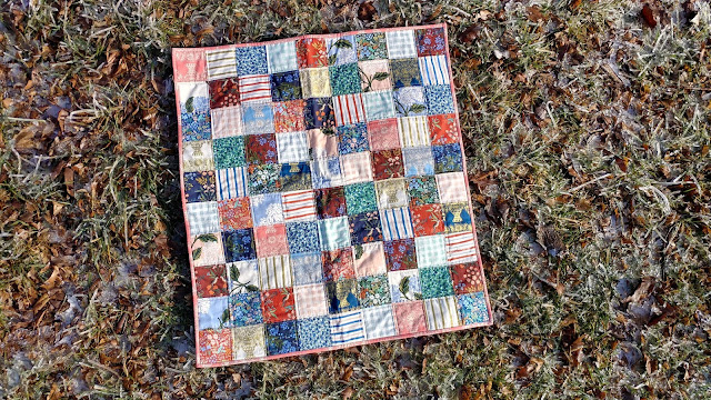 Simple patchwork baby quilt made with Rifle Paper Co. fabric from Cotton + Steel