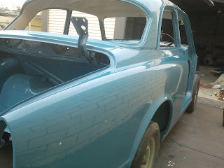 Close up Volvo 122S body after buffing with foam pad and Farecla G10