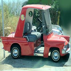 golfing cart old in red color with club holder