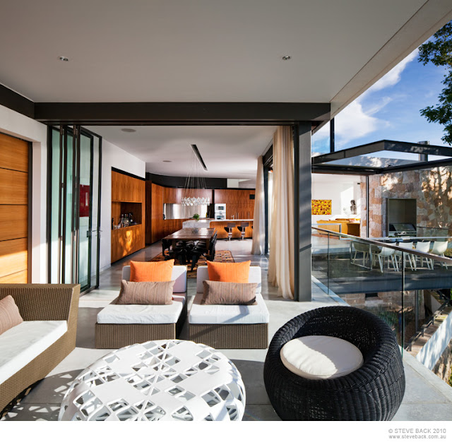 Terrace and dining room in the River House by MCK Architects