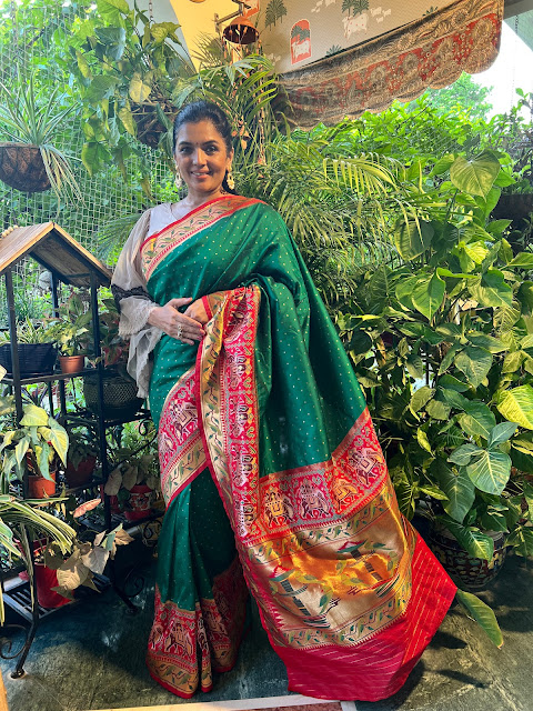 Green and red Banarasi Silk saree with elephants border and pallu