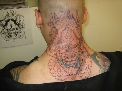 Scary Tribal Devil Tattoo on Back