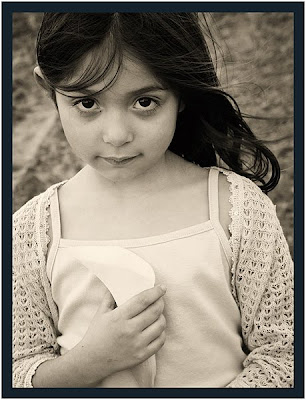 Young girl with flower, Toronto portrait photographer Robert Rafton