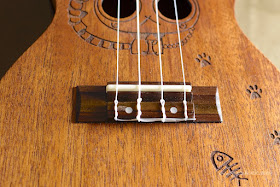 Kmise Carved Cat Concert Ukulele bridge