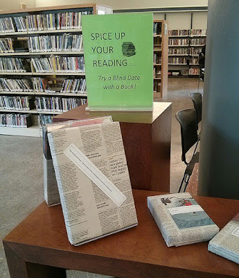 Picture of in-library display of paper-wrapped books for Toronto Public Library's Blind Date with a Book program