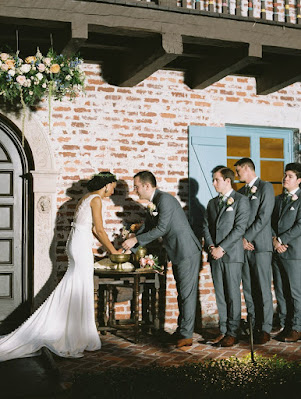 bride and groom hand washing in ceremony