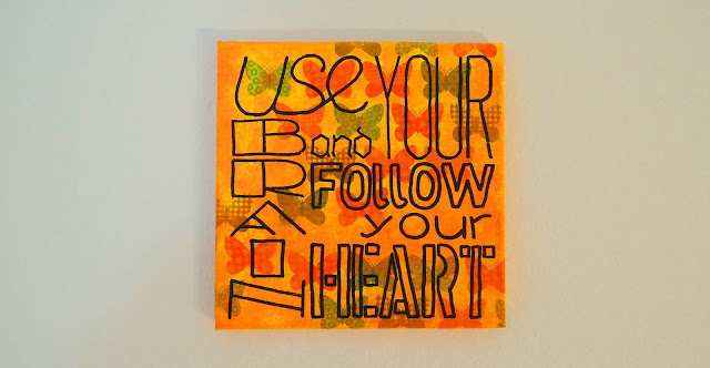 Painting with the words 'use your brain and follow your heart'