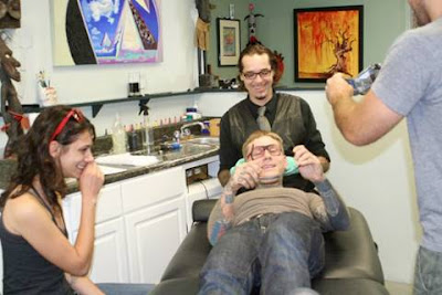 A Guy Gets His Face Tattoed