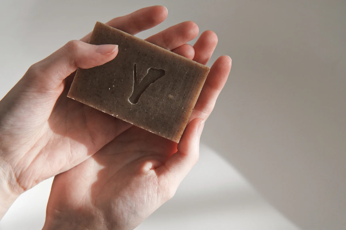 close-up of woman's hands holding a bar of soap