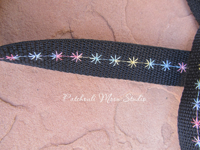 Closeup of decorative stitched webbing strap