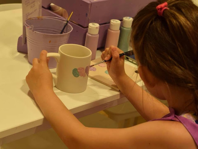 Painting a mug at Emily's Paint a Pot in Next, Manchester Arndale