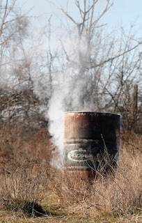 New burning drum, smoking from the outside