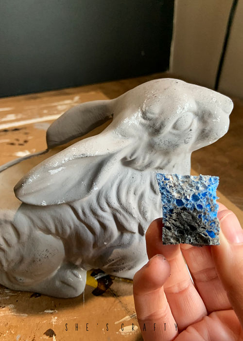 Pounce white paint onto gray painted ceramic bunny.