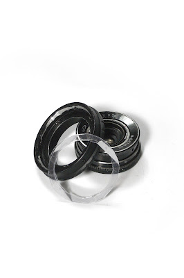 Plastic rings connected with thin double-sided tape...