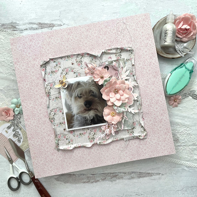Sweet Pups layout created with: Prima Marketing Miel papers, flowers, gems, rub ons, ephemera; Scrapbook.com sprigs dies, satin pearl pops of color, scissors, adhesive; Tim Holtz floral outline stamp, sepeckled egg and spun sugar distress ink, rock candy glitter; Ranger super fine white embossing powder