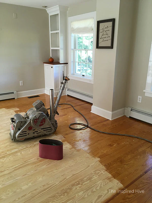 Living room before - refinishing pine floors