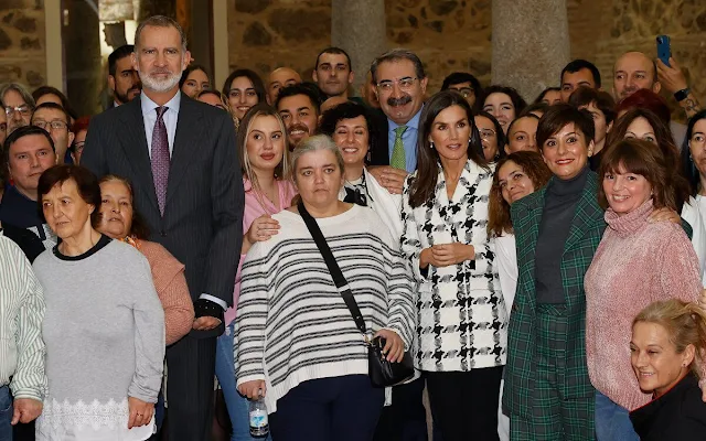 Queen Letizia wore a houndstooth blazer by Uterque, and leather slim pants by Uterque. Diamond flower earrings