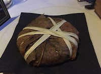 Aged Saint Marcellin wrapped in chestnut leaves