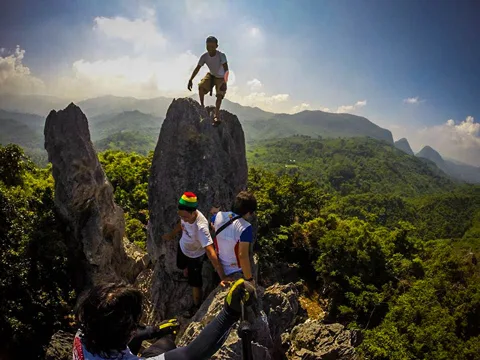 Hikers crawling and exploring the Mt. Sipit Ulang Rock formations